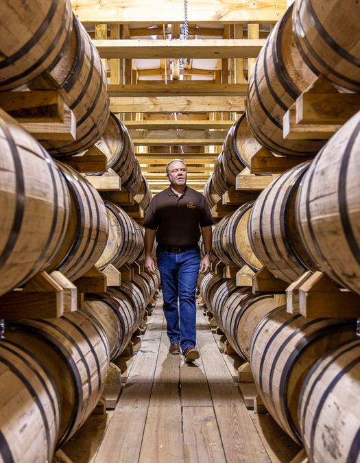 Brent walking through a Four Roses warehouse